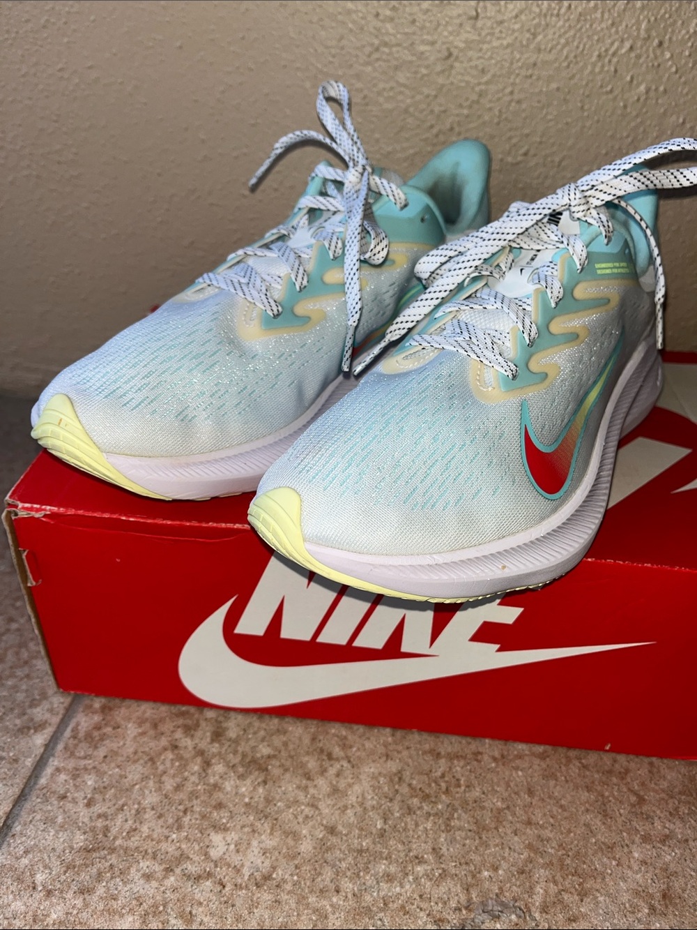 Nike Women's Aqua Mesh Running Shoes with Red Swoosh and Yellow Accents